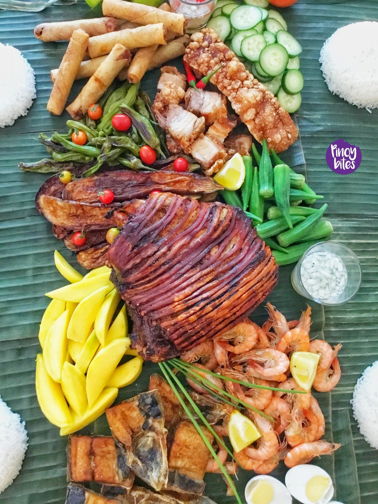 A plate full of Filipino food on a table